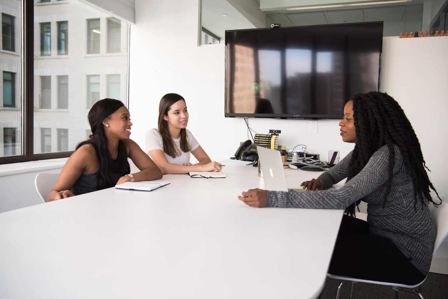 Recruitment professionals discussing candidate sourcing